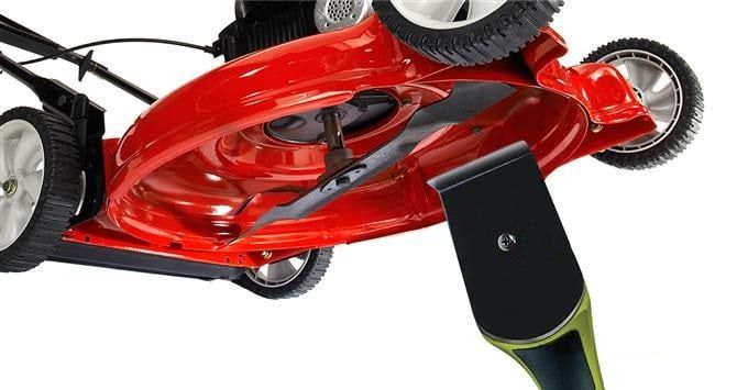 A red lawn mower against a white background. A Grass Hawk Mower Deck Scraper can be seen against the underside of the mower.
