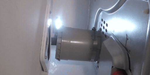 A GIF of a SnugDryer dryer vent connection kit being pushed into the wall plate and rubber gasket of the dryer vent connection point.
