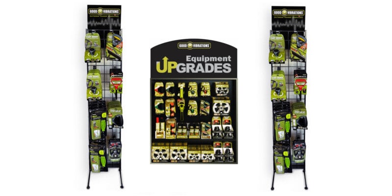 A Good Vibrations inline product display surrounded by two Good Vibrations freestanding displays. All three are set against a white background.