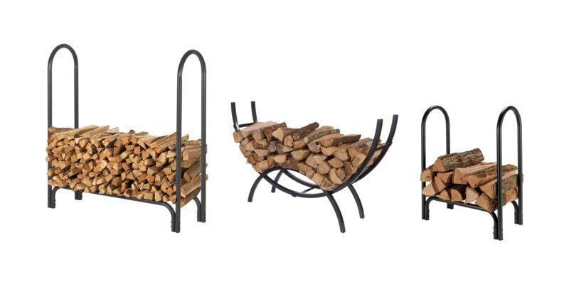 From left to right: a medium-sized Shelter firewood rack, a crescent-shaped Shelter firewood rack, and a small shelter firewood rack. Each rack is loaded with firewood.